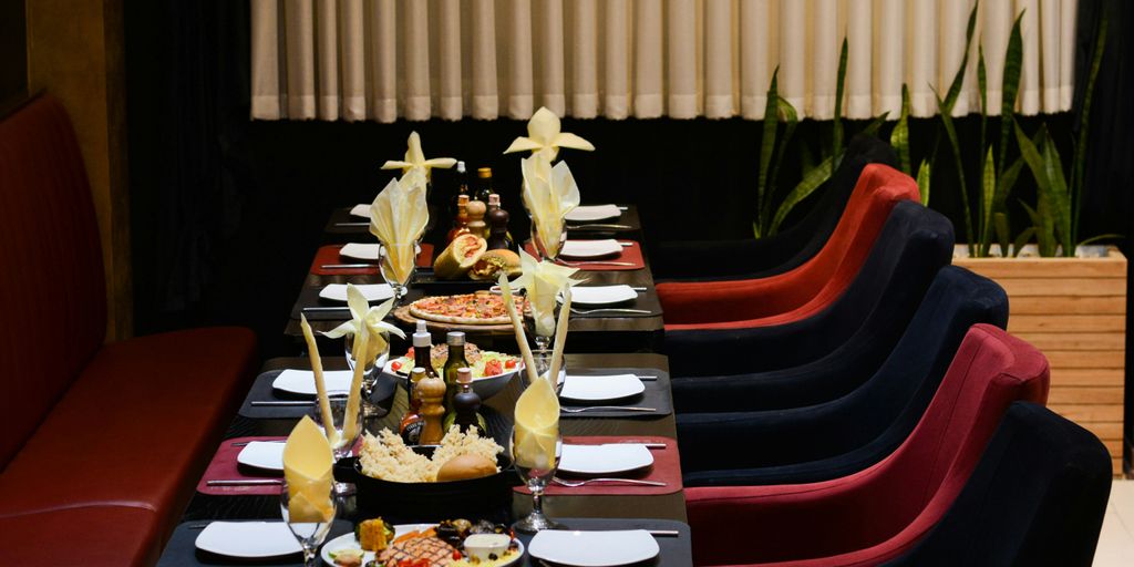 a long table with plates of food on it